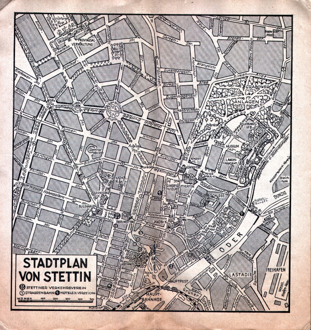 Ein detaillierter alter Stadtplan von Stuttgart auf Papier, der Straßen, Gebäude und Sehenswürdigkeiten zeigt, mit zusätzlichem Text zur Information.