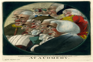 Gruppe von Menschen in einem Kreis lachend, einer hält ein Blatt Papier in der Hand, mit Text 'Bei einer Komödie' unten.